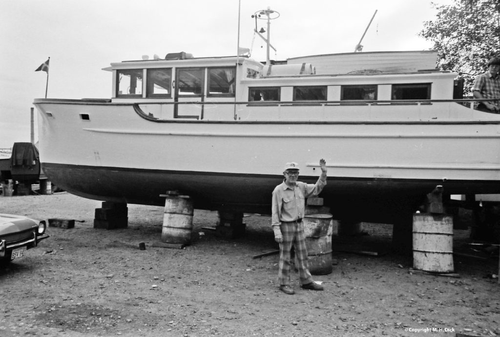 Johnny Martinolich boatbuilder with Martinolich built boat